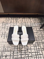 CHANEL MID HEEL MULES IN WHITE SHEEPSKIN