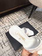 CHANEL MID HEEL MULES IN WHITE SHEEPSKIN
