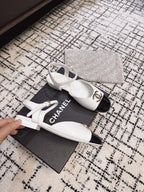 CHANEL FLAT SLINGBACKS IN WHITE MIX BLACK CALFSKIN