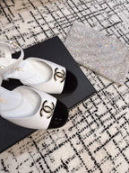 CHANEL FLAT SLINGBACKS IN WHITE MIX BLACK CALFSKIN