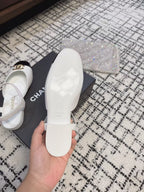 CHANEL FLAT SLINGBACKS IN WHITE MIX BLACK CALFSKIN