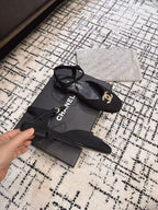 CHANEL FLAT SLINGBACKS IN BLACK FABRIC
