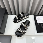 CHANEL dad sandals black white mules