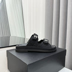 CHANEL dad sandals black textile mules