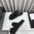 CHANEL dad sandals black textile mules