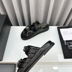 CHANEL dad sandals black lambskin mules
