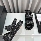 CHANEL dad sandals black denim mules