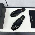 CHANEL BOW MULE IN BLACK MIX WHITE FUR AND CALFSKIN