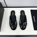 CHANEL BOW MULE IN BLACK MIX WHITE FUR AND CALFSKIN