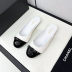 CHANEL BOW MULE IN WHITE FUR AND BLACK CALFSKIN