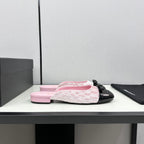 CHANEL BOW MULE IN LIGHT PINK FABRIC AND BLACK CALFSKIN