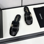 CHANEL FLAT MULE IN BLACK WOOL TWEED AND CALFSKIN GOLD HARDWARE