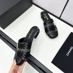 CHANEL FLAT MULE IN BLACK WOOL TWEED AND CALFSKIN GOLD HARDWARE