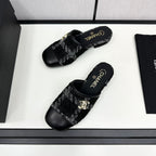 CHANEL FLAT MULE IN BLACK WOOL TWEED AND CALFSKIN GOLD HARDWARE