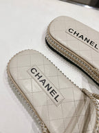 CHANEL WOVEN STRAP SLIPPERS IN WHITE LAMBSKIN