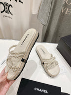 CHANEL WOVEN STRAP SLIPPERS IN WHITE LAMBSKIN