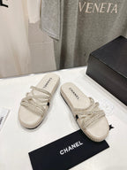 CHANEL WOVEN STRAP SLIPPERS IN WHITE LAMBSKIN