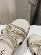 CHANEL WOVEN STRAP SLIPPERS IN WHITE LAMBSKIN
