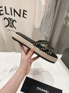 CHANEL WOVEN STRAP SLIPPERS IN BLACK LAMBSKIN