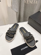 CHANEL WOVEN STRAP SLIPPERS IN BLACK LAMBSKIN