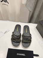 CHANEL WOVEN STRAP SLIPPERS IN BLACK LAMBSKIN