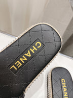CHANEL WOVEN STRAP SLIPPERS IN BLACK LAMBSKIN