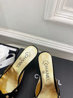 CHANEL HIGH 65 MM MULE IN BLACK SUEDE